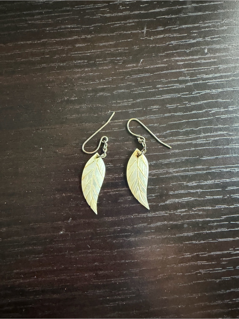 Carved mother-of-pearl feather dangle earrings